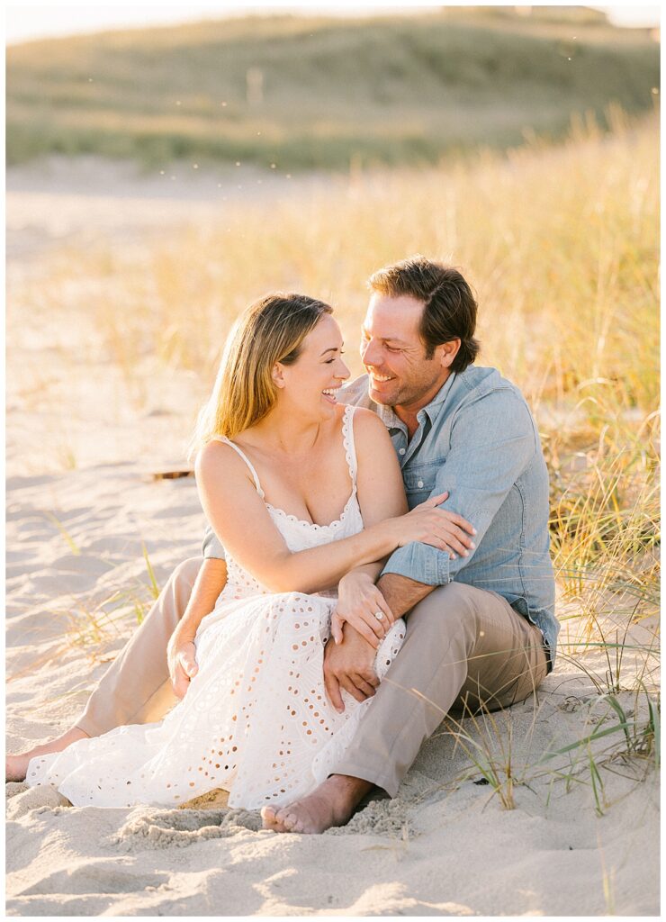 David and Calista share a laugh during their golden hour nantucket engagement photo session.
